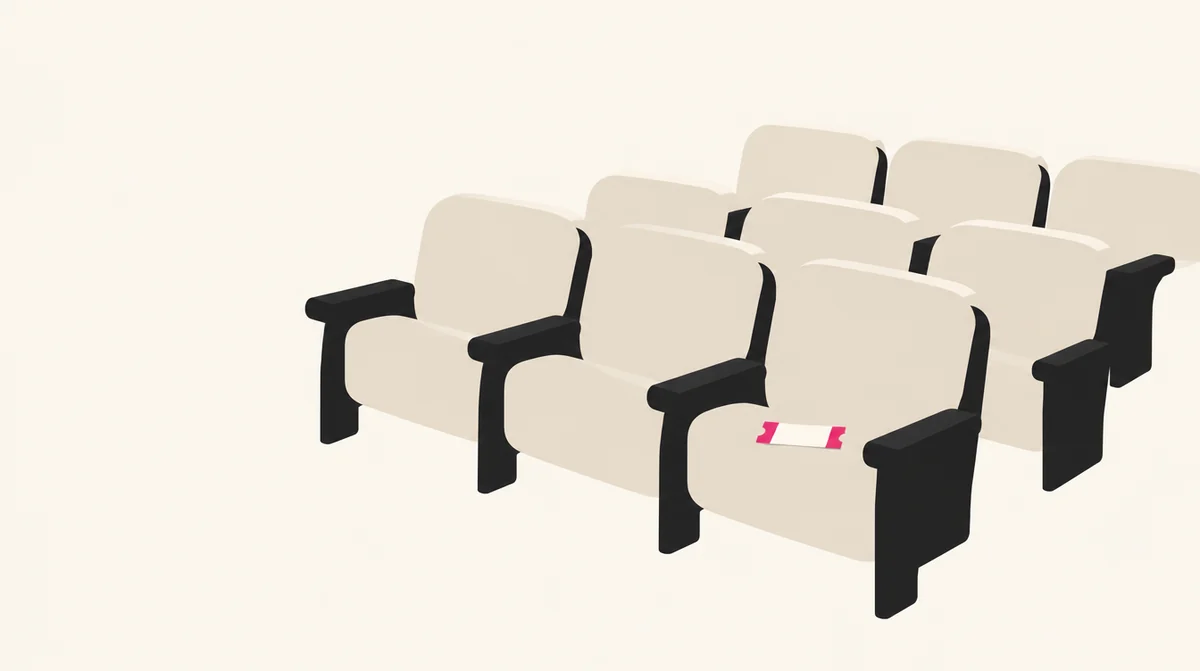 映画館の座席に1枚のチケットが置かれたイラスト